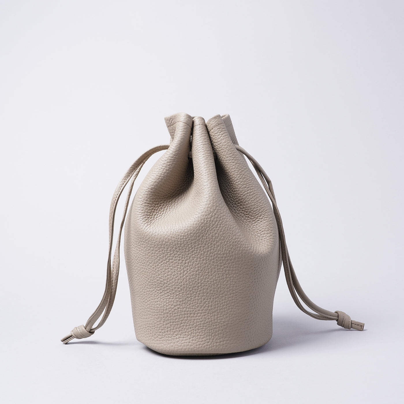 <LEZALI> Embossed Leather Drawstring Mini Bag / Taupe